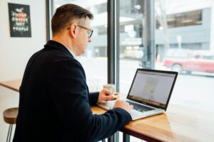 Picture of a salesman on a computer.