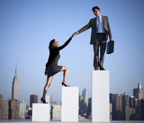 Group of diverse business people with growth graph